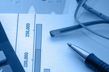 Business Accessories On A Background Of Diagrams