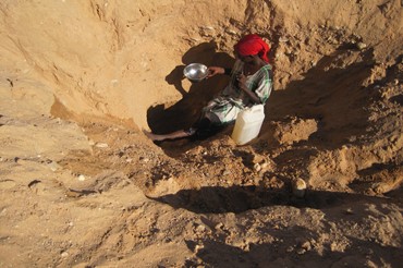 Somalilander Digging For Water In A Wadi